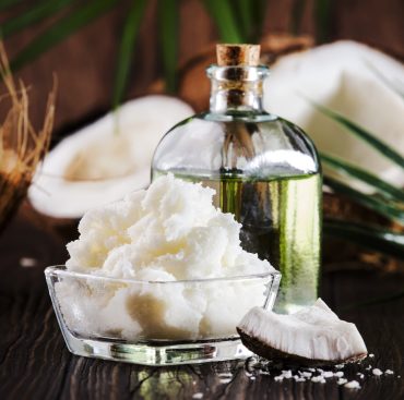 MCT Coconut butter or coconut oil. Organic healthy food, beauty and SPA concept. Copy space